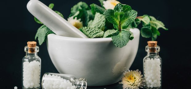 Mortar and pestle with healing herbs